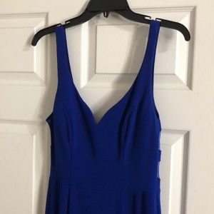 Beautiful blue dress with some see through material in the back.